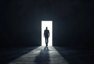 Person stepping forward from a dark shadow into a bright open path symbolizing overcoming Atychiphobia and building confidence