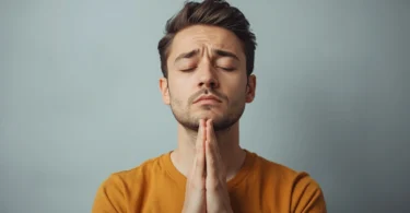Person practicing calm breathing and mindfulness to learn how to not react emotionally during a stressful conversation.