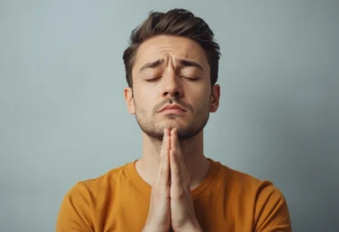 Person practicing calm breathing and mindfulness to learn how to not react emotionally during a stressful conversation.