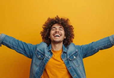 Person expressing high energy emotions through joy, gratitude, confidence, and optimism while enjoying a positive and balanced lifestyle.